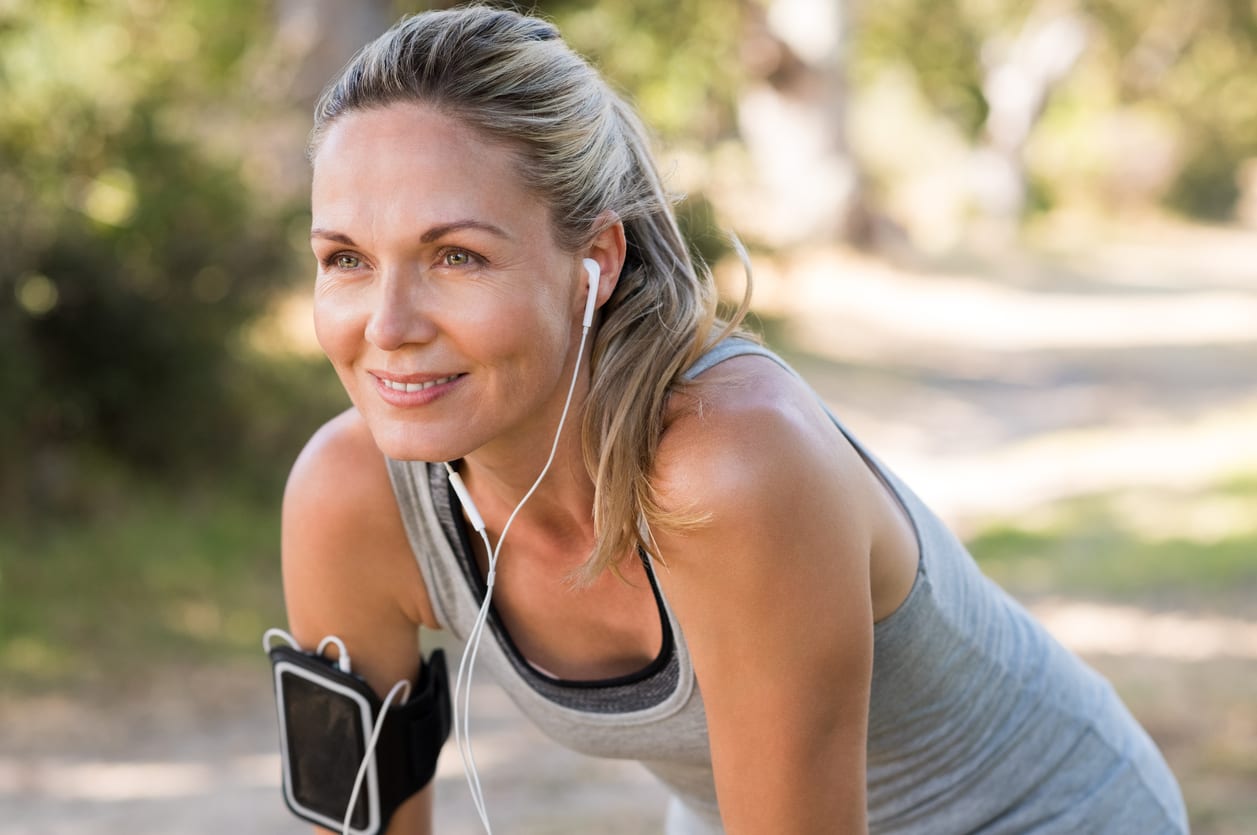 Portrait of beautiful mature woman resting after jogging.