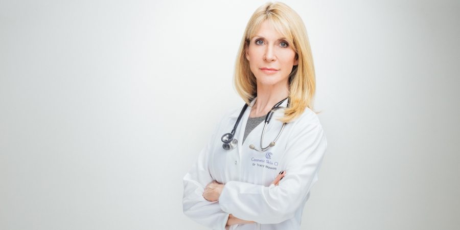 Dr Mountford in white coat with arms crossed