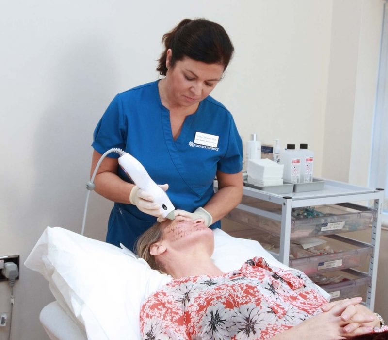 A lady having thermage treatment to the eyes